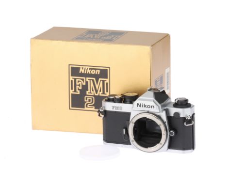 A Nikon FM2 35mm SLR Camera Body, chrome, body VG-E, shutter working, in maker's box,
