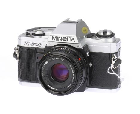 A Minolta X-300 35mm Film SLR Camera, with Minolta MD Rokkor-X f/2 45mm Lens, body, VG, shutter working, lens, G-VG, a few ve