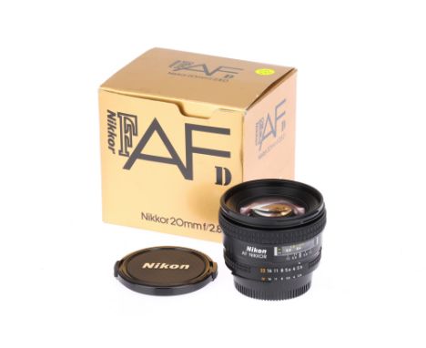 A Nikon AF Nikkor D f/2.8 20mm Lens, black, serial no. 370276, body, VG-E, elements, VG-E, some very light internal haze, com