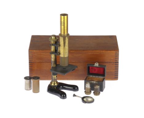 An Early Leitz Microscope, German, c.1900, engraved to the top of the body tube 'E Leitz Wetzlar, No.77908', microscope on bl