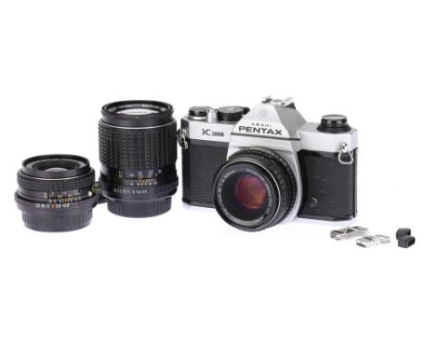 A Pentax K1000 35mm SLR Camera Outfit, chrome, body G, shutter working, together with an SMC Pentax-M f/2 50mm lens, body G, 