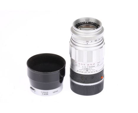 A Leitz Wetzlar Elmarit f/2.8 90mm Lens chrome, 1959, serial no.1684123, body F-G, optics F-G, moderate haze, with 12575 N le