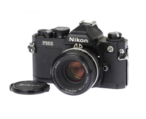 A Nikon FM2n 35mm Film SLR Camera, black, serial no. 8581453, with Nikon Ais Nikkor f/1.8 50mm lens, body, VG-E, shutter work