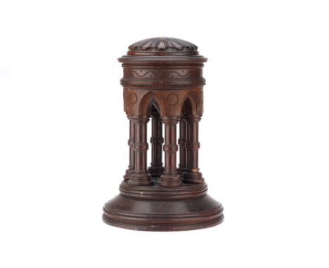 A Gothic Oak Travelling or Portable Font, English, constructed of carved oak on a large base with 6 architectural pillars hol
