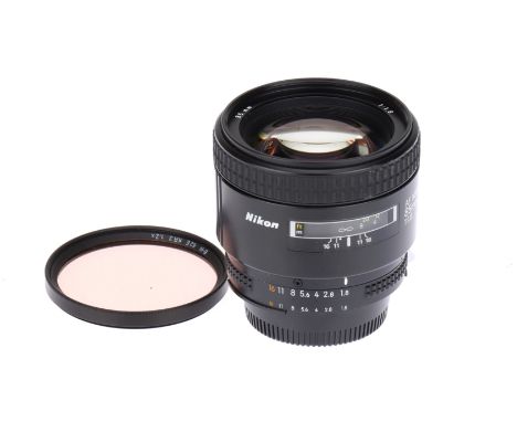 A Nikon AF Nikkor f/1.8 85mm Lens, black, serial no. 275582, body, VG-E, elements, VG, some very light internal haze