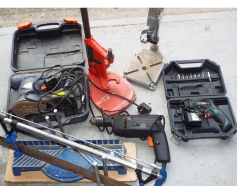 A lot to include drill stands, Black and Decker drill, Parkside screwdriver, Extreme sander and mitre saw and stand This lot 