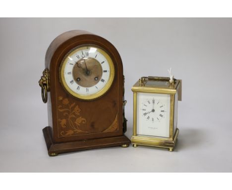 A brass presentation carriage clock together with an inlaid mahogany mantel clock