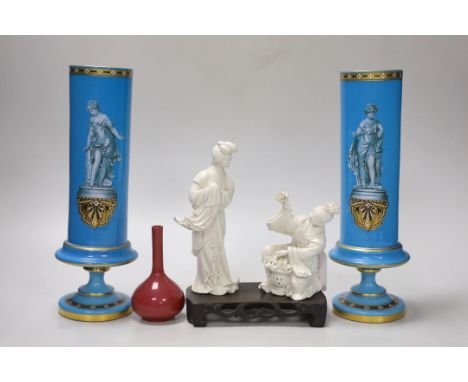 A pair of French enamelled glass vases, two Chinese blanc de chine figures on a stand and a miniature bottle vase, tallest 19