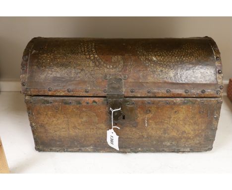 A small leather covered domed trunk, 45cm wide, 26cm high