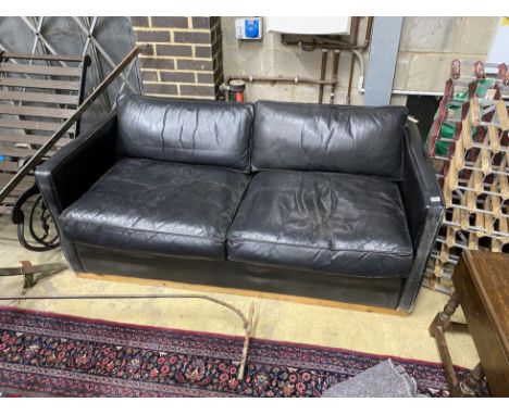 A contemporary black leather upholstered two seater sofa bed, length 172cm