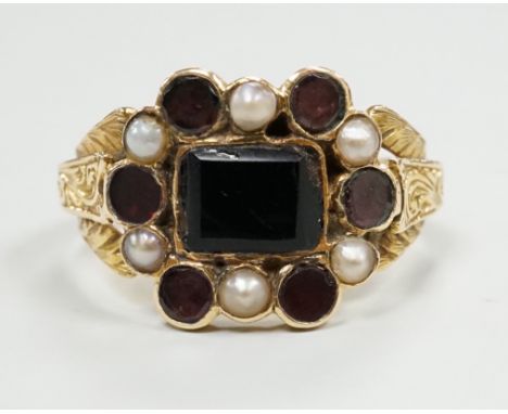A George yellow metal, garnet and seed pearl cluster set mourning ring, with inscription dated 1799, size L, gross weight 2.7