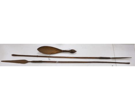 Two African throwing spears and a carved spoon with figural handle, longest spear 132cm