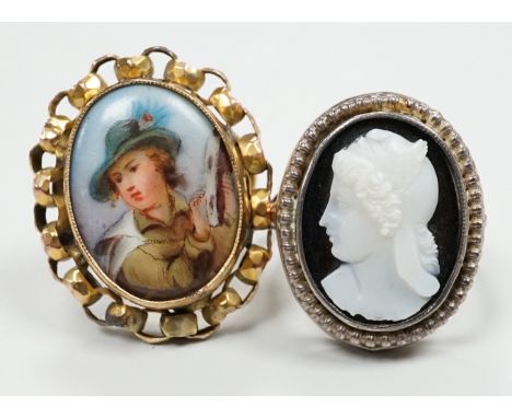 Two yellow metal dress rings, one set with cameo portrait of a lady, the other with porcelain plaque.