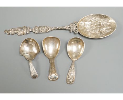 Two 19th century silver caddy spoons, including Birmingham, 1827, one later caddy spoon and an ornate Dutch white metal servi