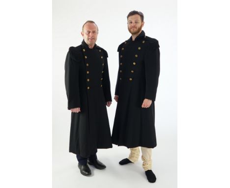Two black military great coats with epaulettes and buttons. Ex Royal Opera House 'Tosca'
