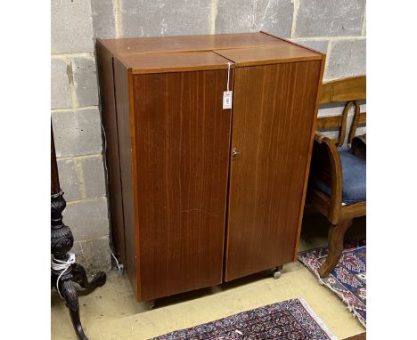 A mid century Newcraft Ltd. teak 'magic box' home office, width 84cm, depth 53cm, height 117cm