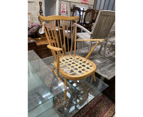 A mid century Ercol light beech armchair frame, width 72cm, depth 60cm, height 84cm