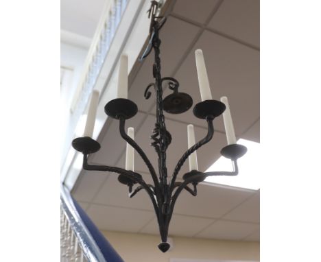 A wrought iron six light chandelier
