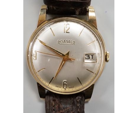 A gentleman's yellow metal Roamer manual wing wrist watch, with case back inscription, on a leather strap.