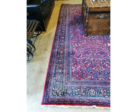 A North West Persian burgundy ground carpet, 364 x 260cm