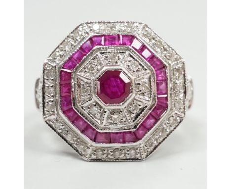 A mid to late 20th century 18ct white gold, ruby and diamond set octagonal cluster target ring, size N/O, gross weight 7.1 gr