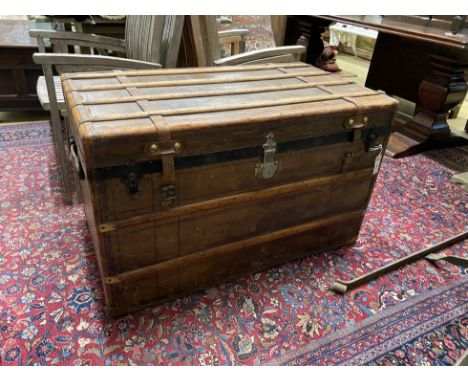 A late 19th century French travelling trunk with interior paper label “A. Bertrand, Paris”, length 106cm, width 60cm, height 