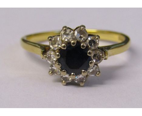 18ct gold sapphire and diamond cluster ring Sheffield 1904 weight 4.1 g (sapphire 0.75 ct, total diamonds 0.35 ct) size R