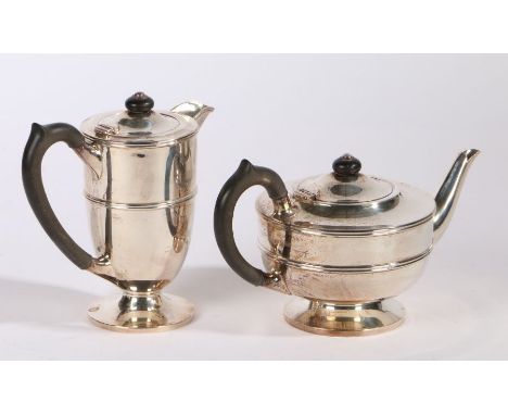 George V silver tea and hot water pots, Birmingham 1925, maker William Hair Haseler Ltd. with ebonised finials and loop handl