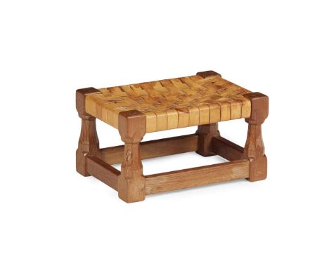  ROBERT 'MOUSEMAN' THOMPSON (1876-1955) FOOTSTOOL, CIRCA 1950 oak, with woven leather seat, carved mouse signature 34cm wide,