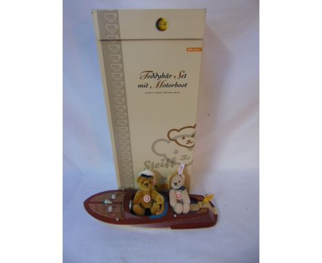 Boxed Steiff speed boat with 2 small Steiff bears