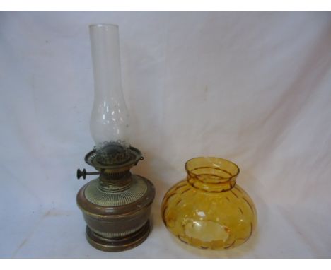 Antique copper oil lamp with amber glass shade