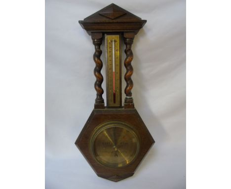 Vintage oak barometer with twisted ends and brass dial