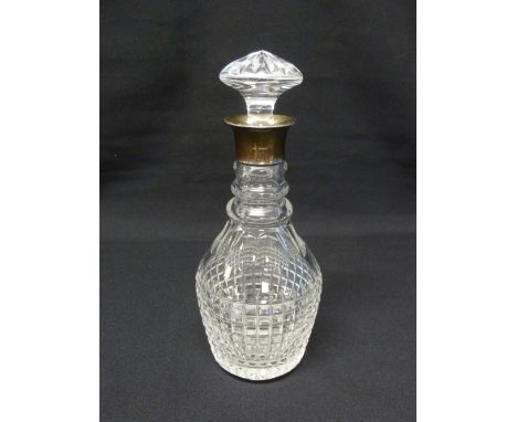 Cut glass decanter with drop stopper and silver collar