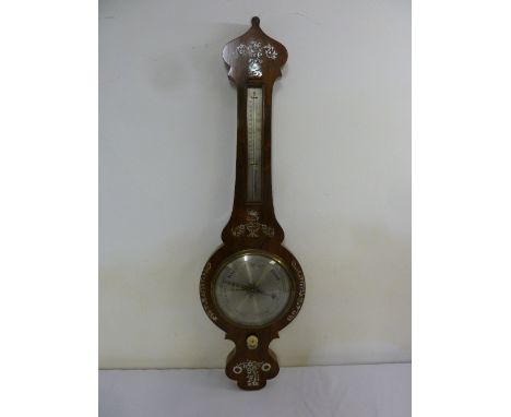 An Edwardian rosewood mercurry barometer cum thermometer inlaid with mother of pearl birds, flowers and leaves