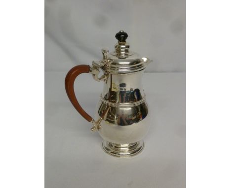 Silver coffee pot in early 18th century style on raised circular base, finial replaced, Birmingham 1924