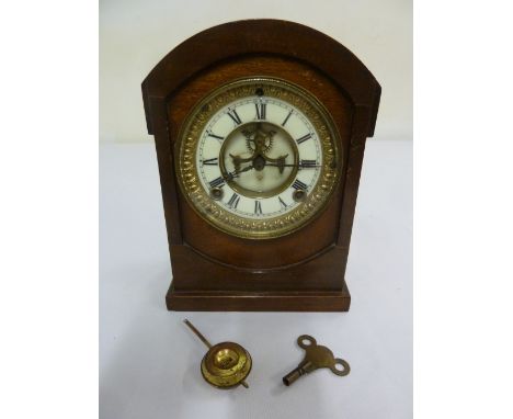 Ansonia Clock Co. Oak cased mantle clock, two train movement, enamel dial with Roman numerals, to include key and pendulum