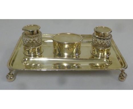 Silver inkstand rectangular with reed and tie borders on four ball and claw feet with two detachable cut glass inkwells and h