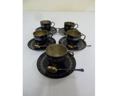 Royal Worcester a set of coffee cups and saucers and matching silver and enamel spoons