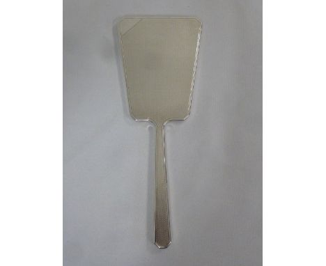 A silver hallmarked engine turned Art Deco hand mirror, London 1929