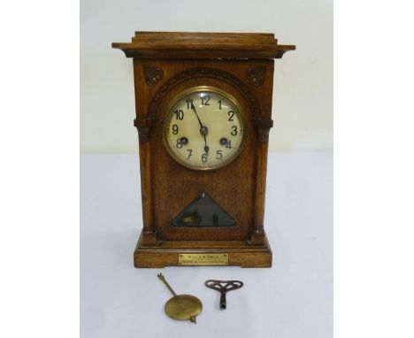 Early 20th century oak cased mantle clock, two train movement to include key and pendulum