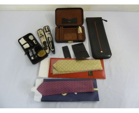 A quantity of collectables to include an Aspreys card holder, an Aspreys jewellery casket, a Gucci leather tie holder, two si