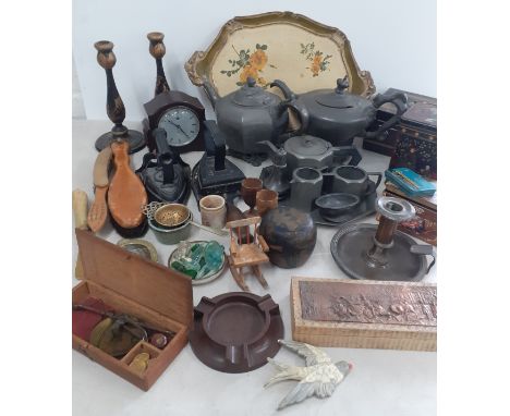 Pewter tea ware, two Victorian irons, a small Smiths mantel clock, a pair of black Oriental lacquered candlesticks, a Chinese