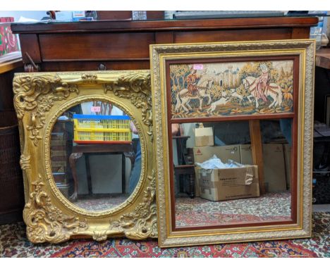 A modern gold painted ornate mirror and a gilt framed mirror with a tapestry panelLocation:If there is no condition report sh