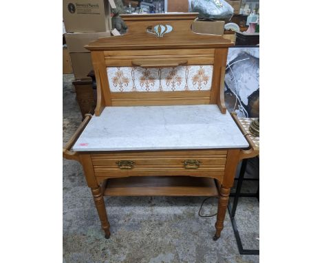Edwardian ash and marble topped washstand, the extended back with single shelf above a four tile panel, white variegated marb