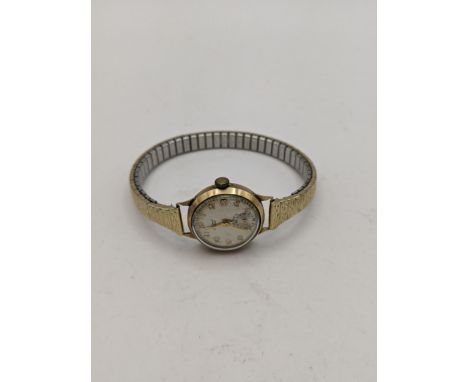 A 9ct gold vintage ladies Accurist manual wind wrist watch and a gold plated expanding bracelet Location: CAB 1 