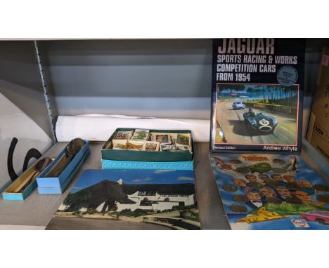 A mixed lot to include The Grand Prix collection print album, the Thunderbirds coin collection, silver plated spoons and othe