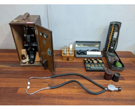 Medicinal equipment to include microscope and a mid century blood pressure machine, weights and a stethoscopeLocation:If ther