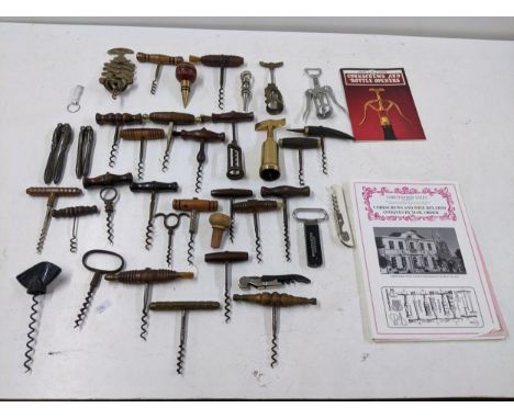 A collection of vintage corkscrews and bottle openers to include a Cognac Courvoisier brass example, a Zig Zag example, vinta