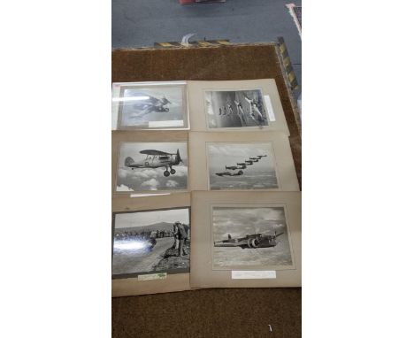 A group of WW2 photographs to include The Handley Page Hampden, Hawker Hurricanes and others, together with a photograph of H