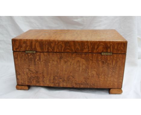 A Victorian Hungarian ash tea caddy of rectangular form, the hinged lid enclosing a pair of lidded compartments and a central